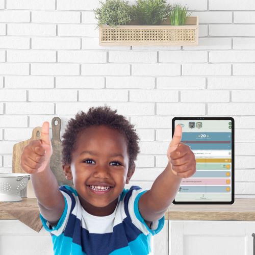 Boy giving thumbs up next to MyWins app on tablet